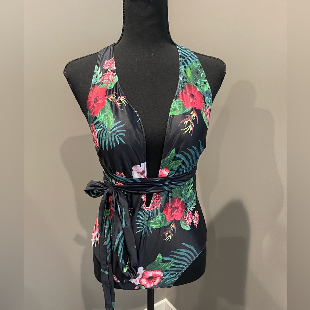 New never worn Sexy low cut one piece swim suit size Medium.